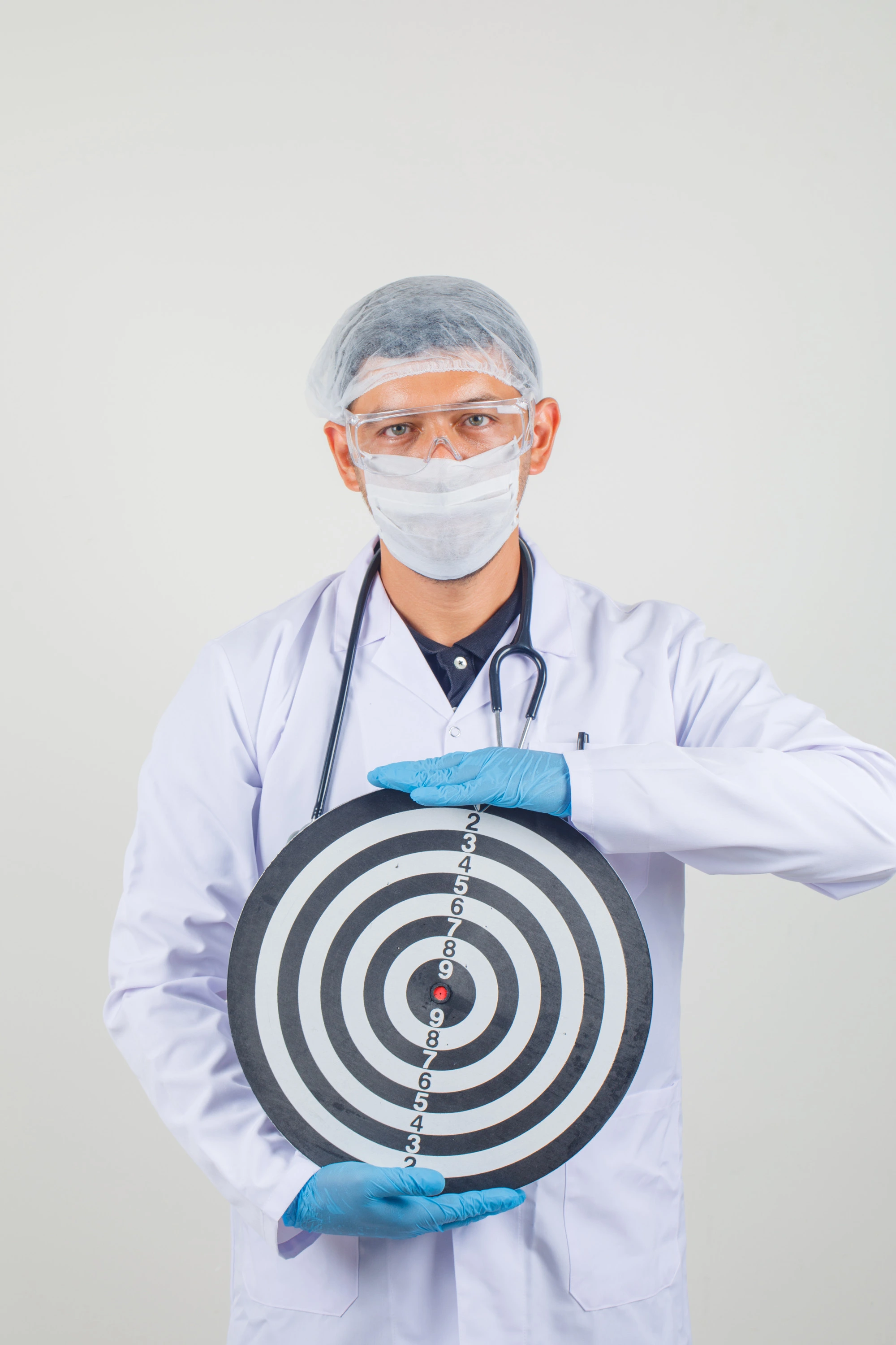 Doctor with target representing focus on outcomes